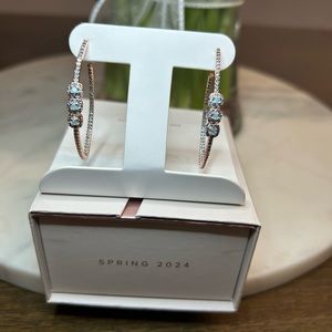 Rose gold hoop earrings with aquamarine ice crystal